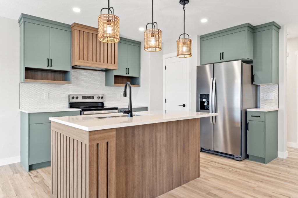 kitchen,with,a,stainless,steel,refrigerator,and,a,wooden,island.